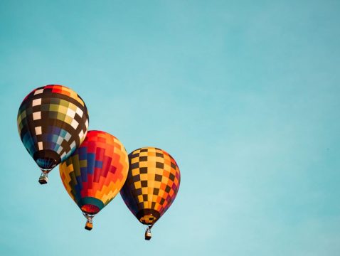 Aaron-Burden-three-balloons-Unsplash